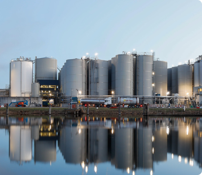 lorries parked outside large biofuel plant