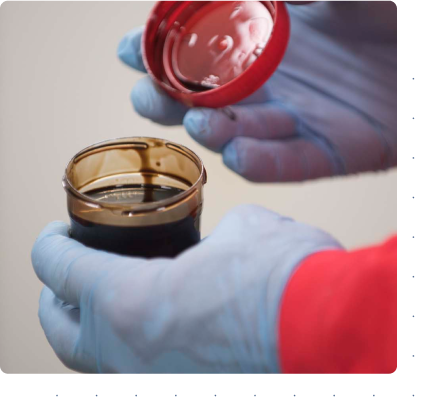 technician holding biofuel sample