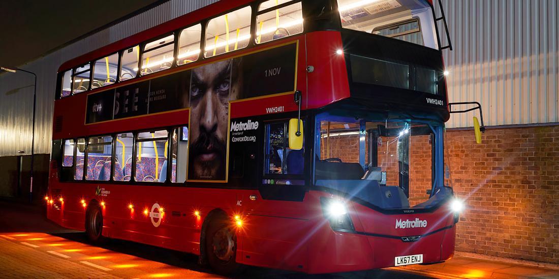 Metroline bus with lights on